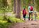 father and two sons walking on hiking path