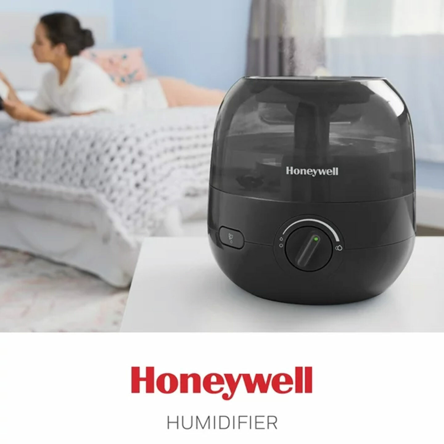 Honeywell mistmate with woman laying on her bed in the background