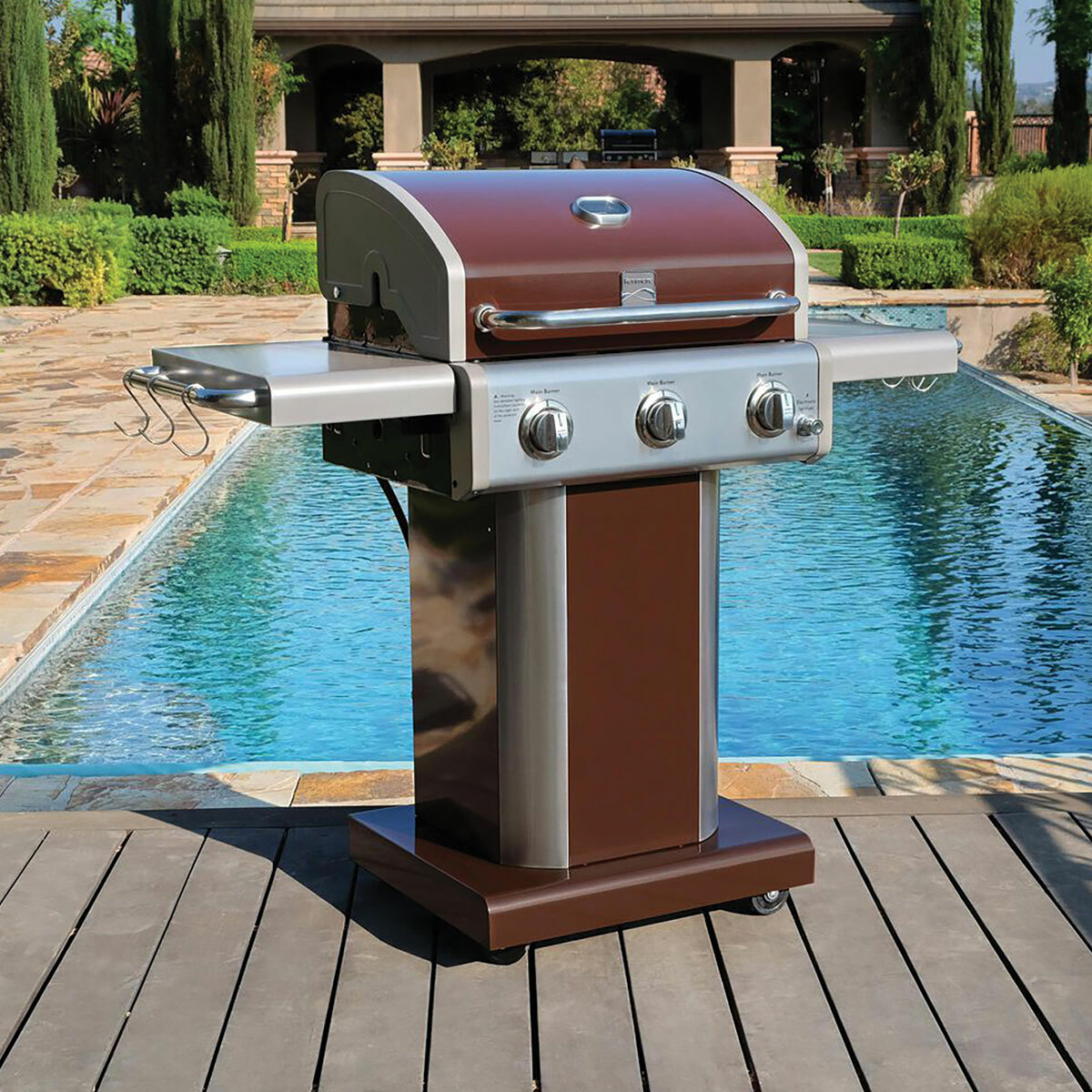 Kenmore pedestal Grill next to pool with shelves up