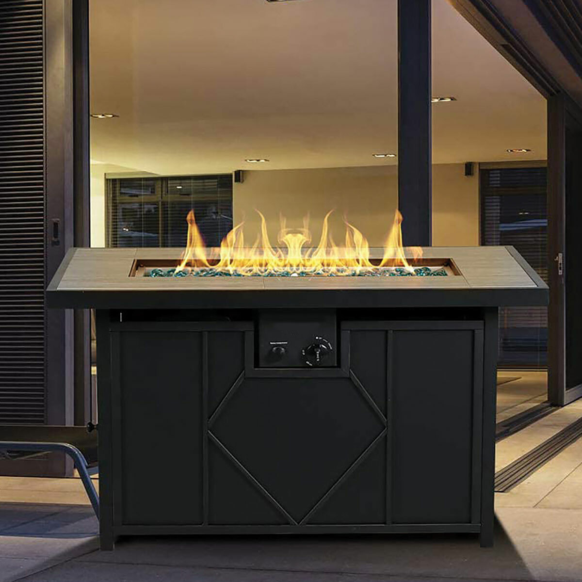 Living Accents 42" Rectangle Fire Pit on patio at night