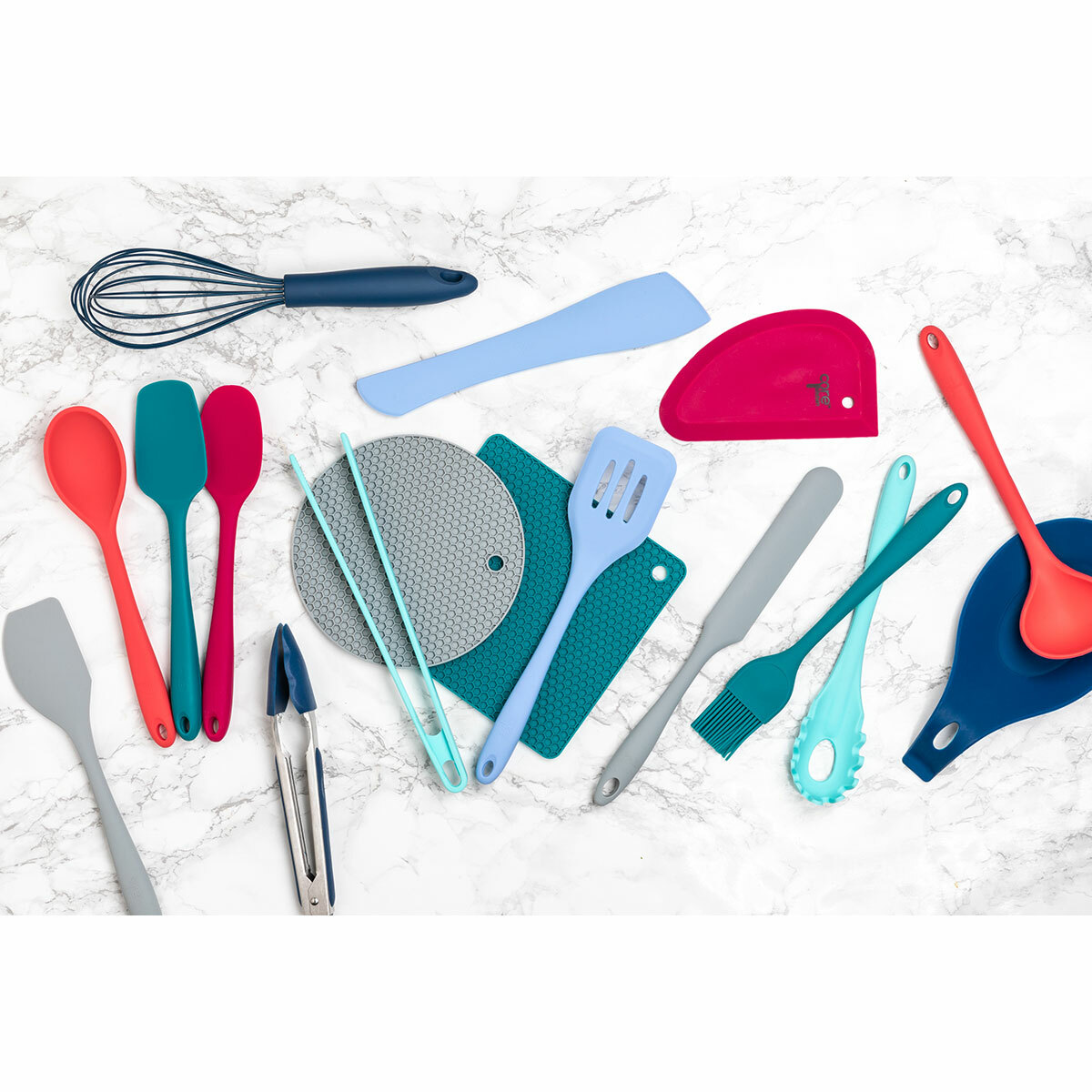 Core Home kitchen gadgets fanned out on a table top, from above.