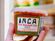 A hand holding a container of Inca Salsa.