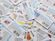 A bunch of coupons sprawled out on a table.