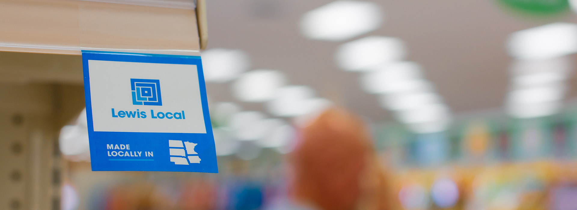 A Lewis Local tag hanging on a shelf.