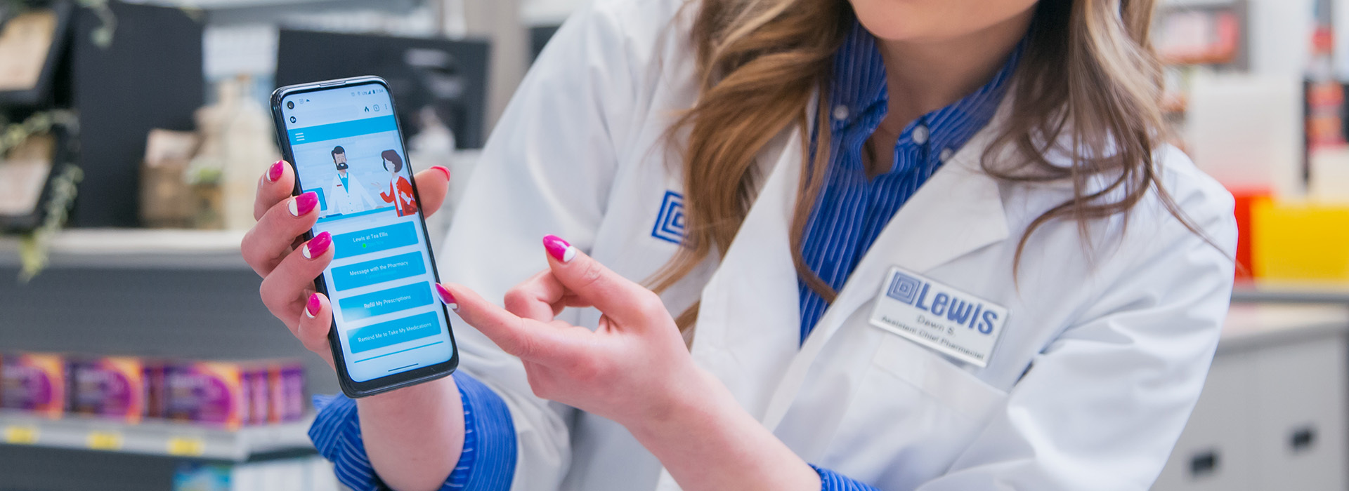 A pharmacist points to a phone with the RxLocal App.