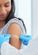 Nurse putting bandaid over vaccination spot on woman's arm